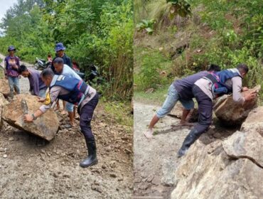 Bhabinkamtibmas Polres Tana Toraja bergerak cepat membersihkan material longsor di Kecamatan Rano. Foto: Istimewa