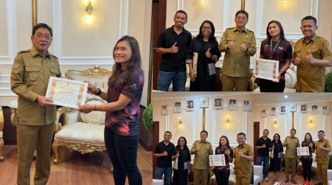 
					Bupati Toraja Utara Frederik Victor Palimbong, serahkan Piagam Penghargaan kepada Diando Upa Salurante peraih Juara 1 Kategori Wanita jarak 100 Kilometer Dievent Trail Run Rinjani 100. Foto: Istimewa
